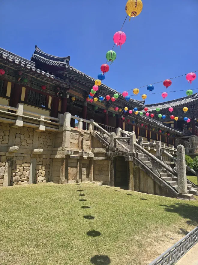 Stone steps lead up to a traditional Korean building