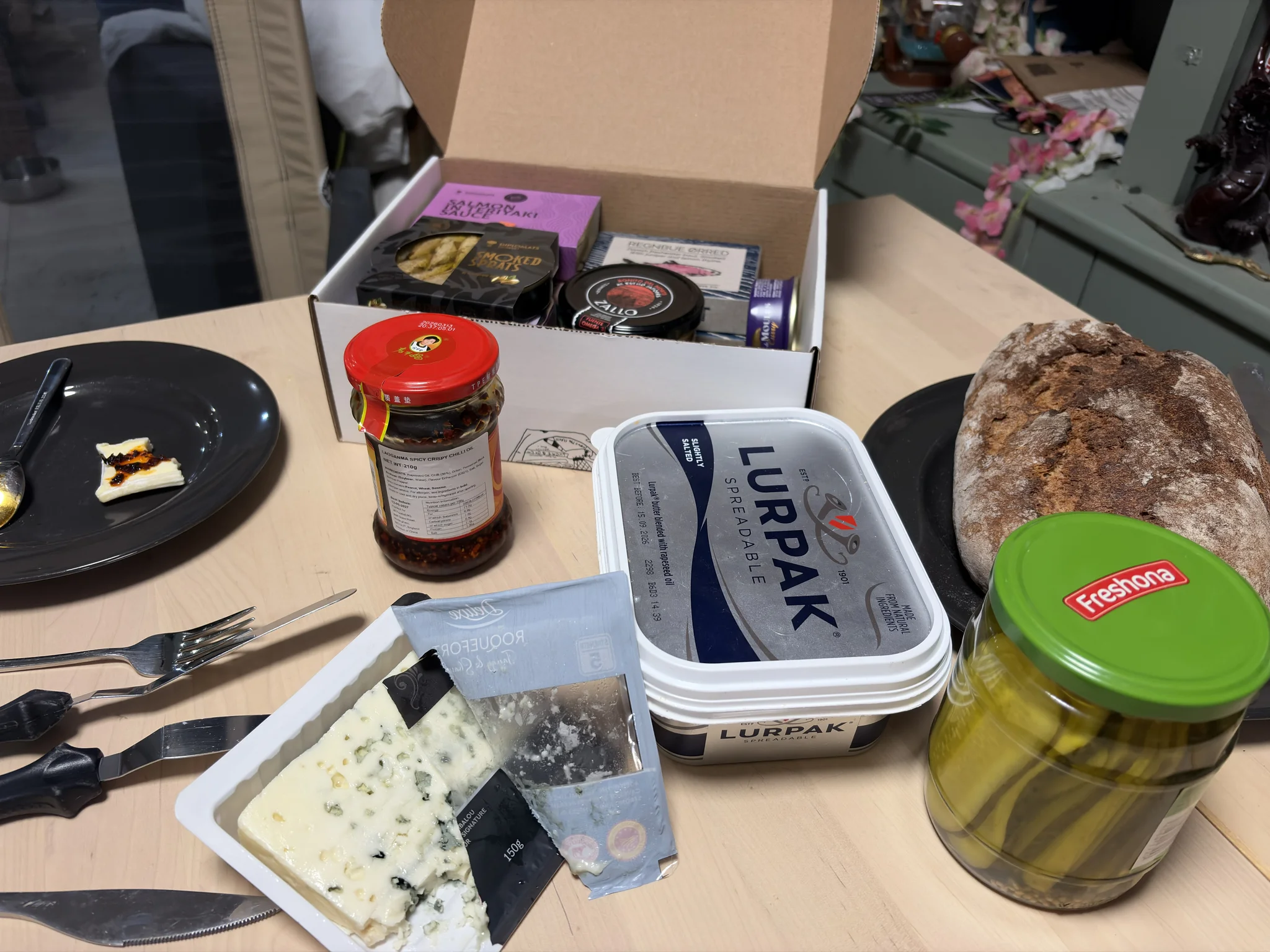 Cheese, Chilli Crisp, and Tinned Fish == Perfection A selection of foods on a table